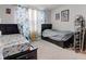 Comfortable bedroom featuring two twin beds, neutral walls, and window with curtains at 13872 N Mardenis W Dr, Camby, IN 46113