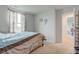 Bedroom with a window view and neutral tones complemented by brown and blue bedding at 13872 N Mardenis W Dr, Camby, IN 46113