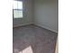 Cozy bedroom showcasing plush carpet and a bright window for ample natural light at 13872 N Mardenis W Dr, Camby, IN 46113