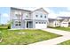 Charming two-story home with a two-car garage, manicured lawn and inviting curb appeal at 13872 N Mardenis W Dr, Camby, IN 46113