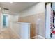 Upstairs hallway features white trim and neutral carpeting and walls at 13872 N Mardenis W Dr, Camby, IN 46113