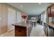 Spacious kitchen features a center island, tile floors, and a dining area with ample natural light at 13872 N Mardenis W Dr, Camby, IN 46113