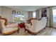 Elegant living room with luxurious furnishings, large windows, and neutral decor at 13872 N Mardenis W Dr, Camby, IN 46113