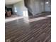 Open living room featuring hardwood floors and a view of the staircase and hallway at 13872 N Mardenis W Dr, Camby, IN 46113