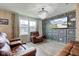 Comfortable living room featuring a stylish accent wall, modern lighting, and comfortable leather furniture at 13872 N Mardenis W Dr, Camby, IN 46113