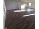 Spacious living room featuring hardwood flooring and natural light from the window at 13872 N Mardenis W Dr, Camby, IN 46113