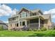 Spacious backyard with well-maintained lawn, covered patio, and appealing exterior at 14747 Harvest Glen S Blvd, Fishers, IN 46037