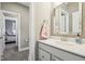 Bathroom featuring a vanity with a gray cabinet, a large framed mirror and tile floors at 14747 Harvest Glen S Blvd, Fishers, IN 46037