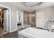 This bathroom features a large tub, a walk in shower, and neutral walls at 14747 Harvest Glen S Blvd, Fishers, IN 46037