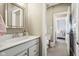 Bathroom featuring sleek vanity, and a peek into the adjacent bedroom at 14747 Harvest Glen S Blvd, Fishers, IN 46037