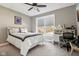 Well-lit bedroom with a dedicated desk area and comfortable bed at 14747 Harvest Glen S Blvd, Fishers, IN 46037