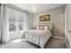 Bedroom with a large window, neutral colored walls and carpet, and white trim and curtains at 14747 Harvest Glen S Blvd, Fishers, IN 46037