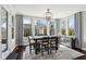 Bright dining room features large windows with backyard views and modern decor at 14747 Harvest Glen S Blvd, Fishers, IN 46037