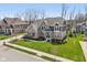Charming brick and gray two-story home with professional landscaping and inviting front entrance at 14747 Harvest Glen S Blvd, Fishers, IN 46037