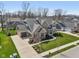 Beautiful two-story brick home with a well-manicured lawn and attached three car garage at 14747 Harvest Glen S Blvd, Fishers, IN 46037