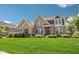 Charming two-story brick home with manicured landscaping at 14747 Harvest Glen S Blvd, Fishers, IN 46037