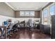 Spacious home office featuring hardwood floors, ample natural light, and custom built-in desks for multiple users at 14747 Harvest Glen S Blvd, Fishers, IN 46037