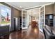 Open office space showcases wood floors, natural light, and access to a dining area through glass doors at 14747 Harvest Glen S Blvd, Fishers, IN 46037