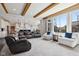 Bright, open-concept living area with hardwood floors, fireplace, and modern kitchen at 14747 Harvest Glen S Blvd, Fishers, IN 46037