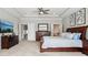 Main bedroom with tray ceilings, hardwood furniture and ensuite bathroom and closet access at 14747 Harvest Glen S Blvd, Fishers, IN 46037