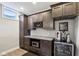 Basement wet bar features custom cabinets, granite countertops, wine storage, and beverage cooler at 14747 Harvest Glen S Blvd, Fishers, IN 46037