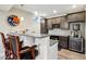 Basement wet bar offers custom cabinets, granite counters, bar stool seating, and a beverage cooler at 14747 Harvest Glen S Blvd, Fishers, IN 46037