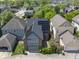 Aerial view of home with solar panels surrounded by lush greenery at 1537 Carrollton Ave, Indianapolis, IN 46202