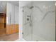 Elegant bathroom featuring a glass-enclosed shower with marble accents and walk-in closet at 1537 Carrollton Ave, Indianapolis, IN 46202