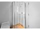 Bathroom shower features tiled walls, glass doors, and modern fixtures at 1537 Carrollton Ave, Indianapolis, IN 46202