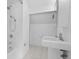 Clean bathroom featuring a tub/shower combination, white vanity and tiled floors at 1537 Carrollton Ave, Indianapolis, IN 46202