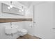 Modern bathroom featuring white subway tile, a floating sink, and tiled floors at 1537 Carrollton Ave, Indianapolis, IN 46202