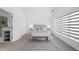 Inviting bedroom with a plush bed, soft lighting, and a large window at 1537 Carrollton Ave, Indianapolis, IN 46202