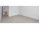 Cozy bedroom with neutral carpet, closet and ample natural light at 1537 Carrollton Ave, Indianapolis, IN 46202