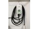 Close up of a wall mounted electric vehicle charger with coiled cord at 1537 Carrollton Ave, Indianapolis, IN 46202