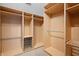 Organized walk-in closet with custom shelving and plenty of room for storage at 1537 Carrollton Ave, Indianapolis, IN 46202