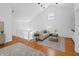 Bright living room with high ceilings, hardwood floors and a neutral color palette at 1537 Carrollton Ave, Indianapolis, IN 46202