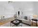 Cozy living area with a comfortable couch, decorative pillows, and a stylish coffee table, creating a relaxed space at 1537 Carrollton Ave, Indianapolis, IN 46202