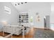 Bright living room with built-in shelving and white walls with lots of natural light, creating a modern aesthetic at 1537 Carrollton Ave, Indianapolis, IN 46202