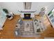 Open-concept living room with a fireplace, neutral decor, and abundant natural light, perfect for relaxation at 1537 Carrollton Ave, Indianapolis, IN 46202
