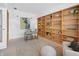 Bright office featuring built-in shelving, a desk, and comfortable seating, perfect for a productive workspace at 1537 Carrollton Ave, Indianapolis, IN 46202