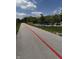 Asphalt walking path with a red line that leads to the community playground at 1537 Carrollton Ave, Indianapolis, IN 46202
