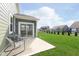 Relax on this backyard patio with a view of the lawn at 1695 Jackson St, Fortville, IN 46040
