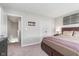 Cozy bedroom with carpeted floors, neutral walls, and a double door closet at 1695 Jackson St, Fortville, IN 46040