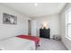 Bedroom featuring a dresser, a double door closet, carpet flooring, and a bright window at 1695 Jackson St, Fortville, IN 46040