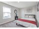 Bedroom featuring a window, carpet flooring, and a comfortable bed at 1695 Jackson St, Fortville, IN 46040