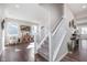 Open entryway showcasing hardwood floors, a staircase with white railing, and access to a living space at 1695 Jackson St, Fortville, IN 46040