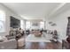 Spacious living room with hardwood floors, neutral tones, ample seating, and natural light at 1695 Jackson St, Fortville, IN 46040