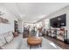 Open concept living area with hardwood floors, kitchen view, and comfortable seating arrangement at 1695 Jackson St, Fortville, IN 46040