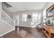 Bright living room featuring hardwood floors, modern decor, and large windows for plenty of natural light at 1695 Jackson St, Fortville, IN 46040