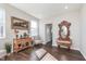 Open living room featuring hardwood floors, lots of natural light, and tastefully designed decor at 1695 Jackson St, Fortville, IN 46040